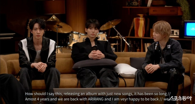 BTS members discussing the conceptual framework of their new album Arirang during a media event.