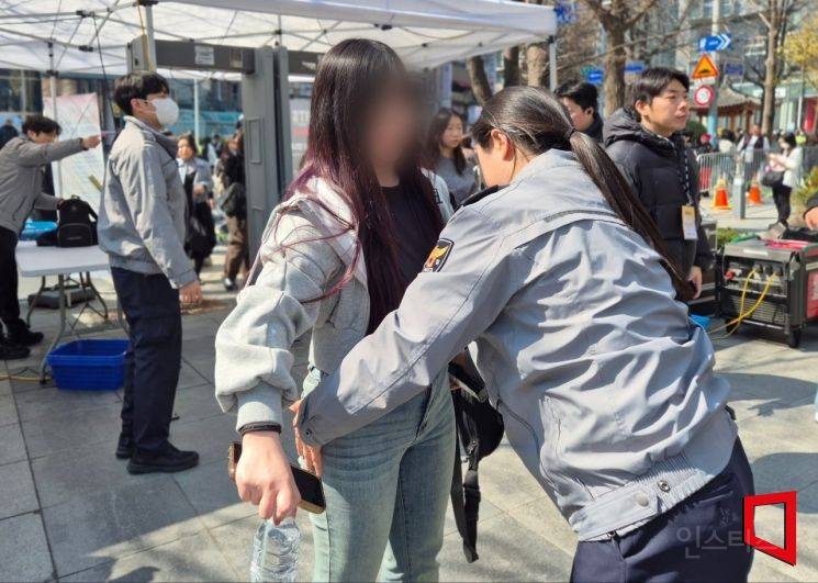 Police officers managing the strict security perimeter in central Seoul