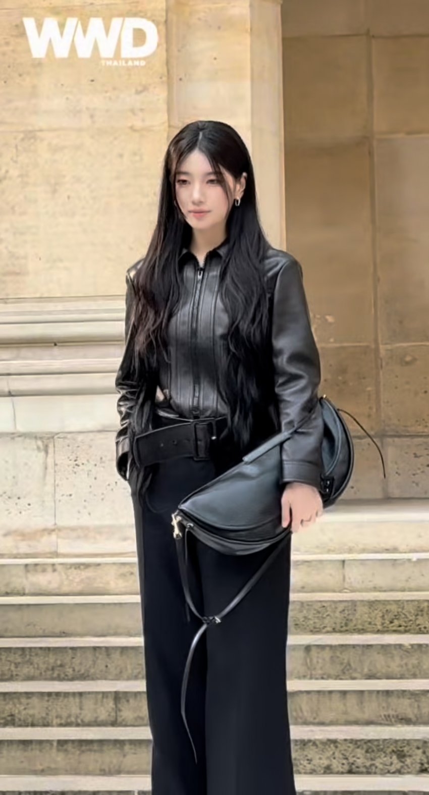 Suzy smiling warmly for the cameras, showing off her sophisticated and modern Celine look with confidence.