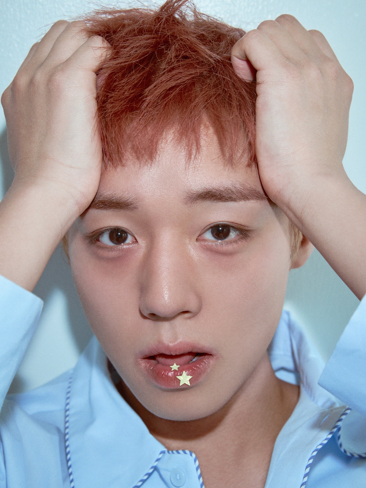 Close-up of Park Ji Hoon's face showing off the satin-glow skin and feathered brow beauty trend for 2026