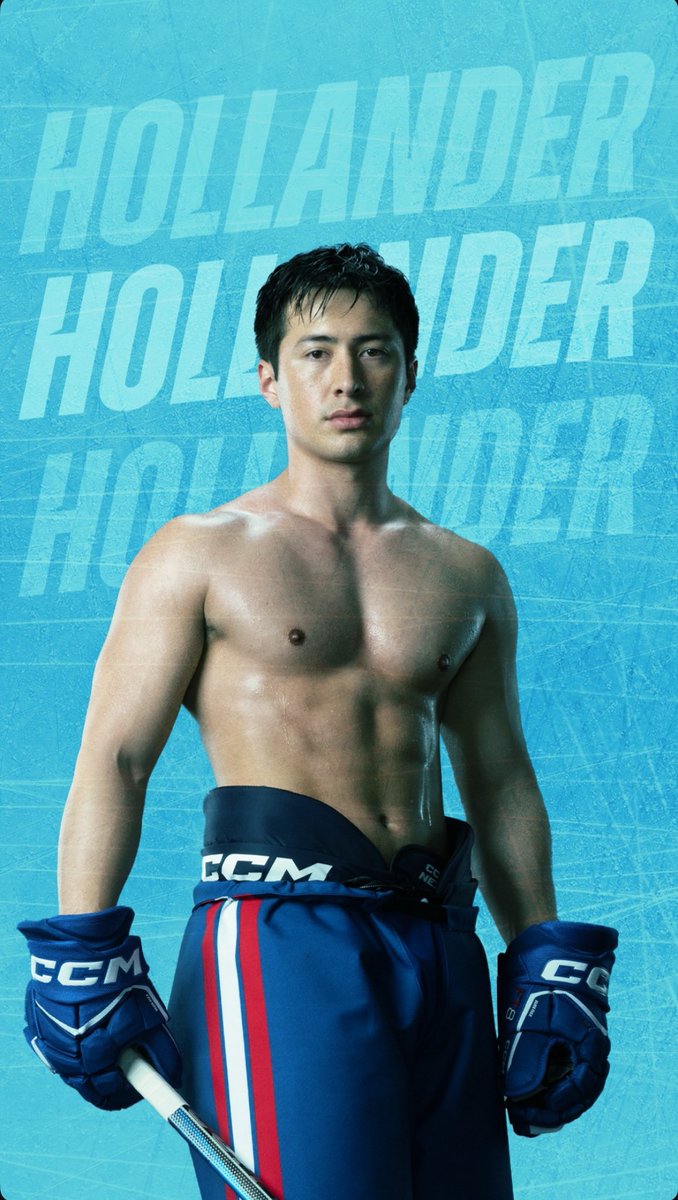 ハドソン・ウィリアムズが笑顔でポーズをとっている。短髪でがっしりした体格が特徴。