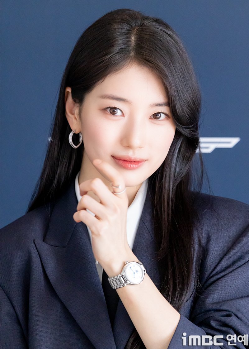 Close up of Suzy showing off her Longines watch and perfect makeup