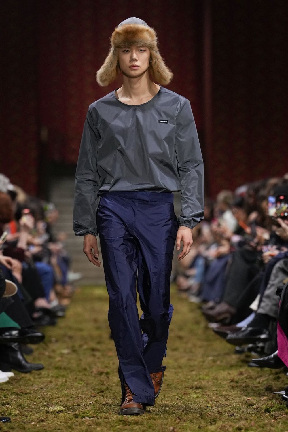 Close-up of Yeonjun's sharp features and Miu Miu styling during the Paris show