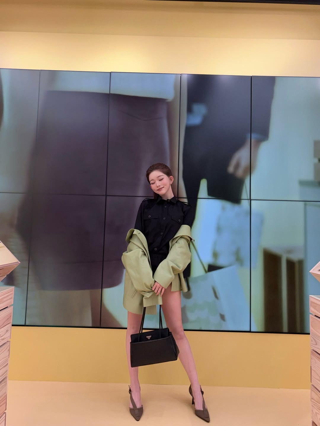 Full body shot of Tsuki at the Prada event, showing the incredible length of her legs and her perfect posture.