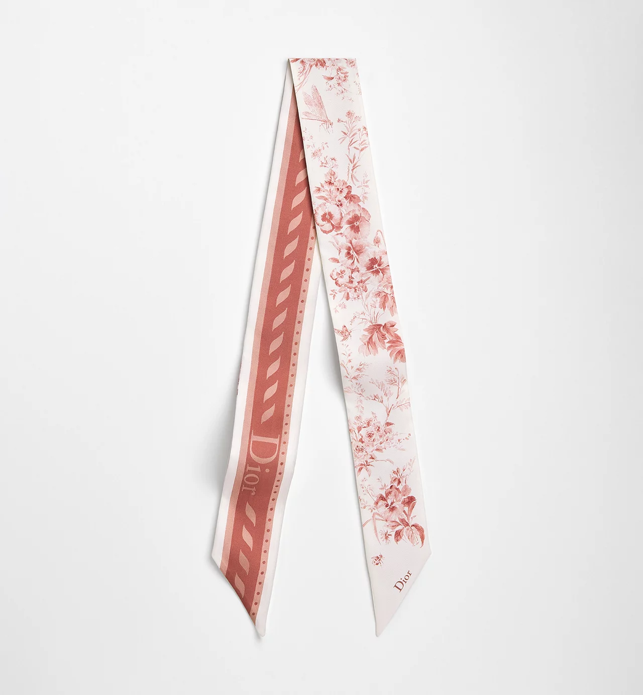 Dior scarf styled elegantly on a luxury handbag, showing the versatility of the accessory