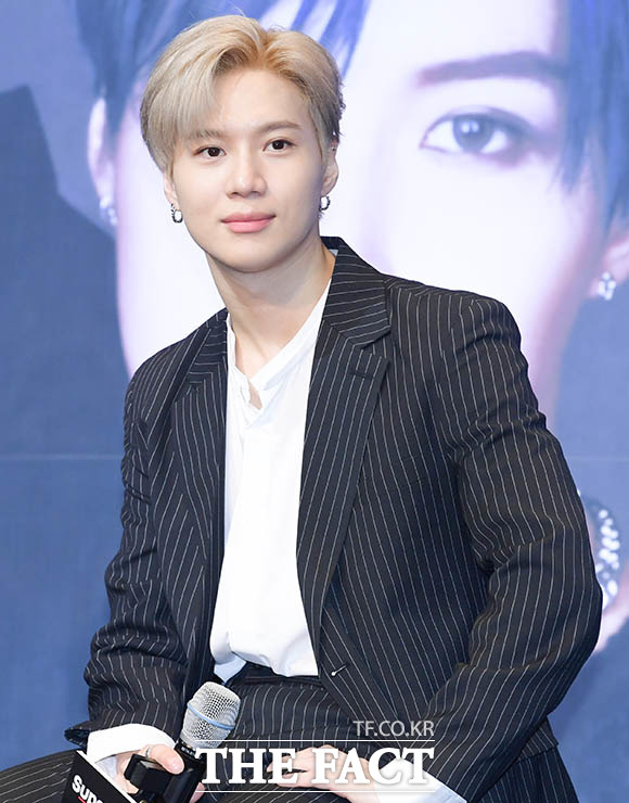 Taemin posing for an official profile shoot following his move to Galaxy Corporation