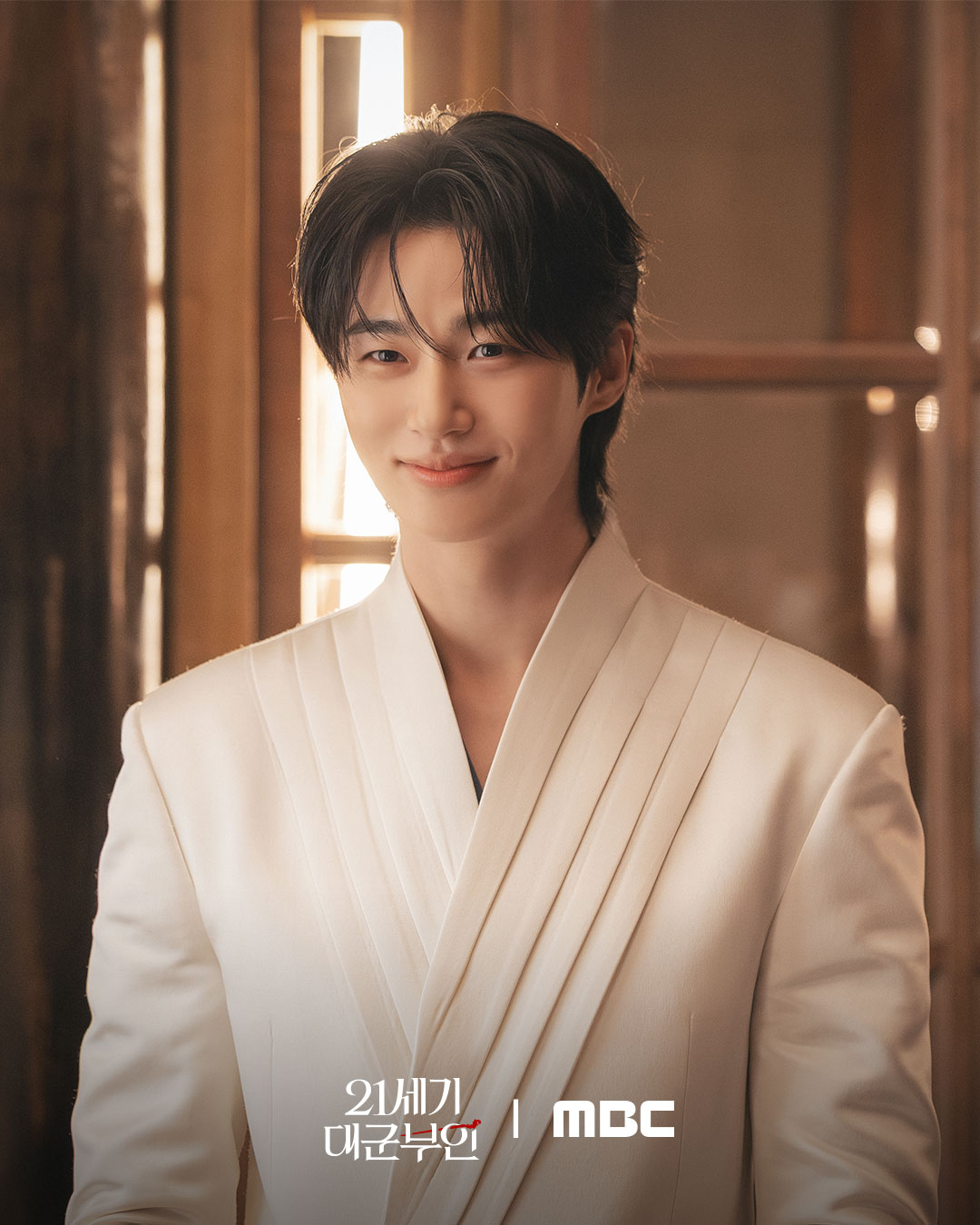 A moody, atmospheric shot of Byeon Woo-seok reflecting the 'lonely prince' theme of the drama.