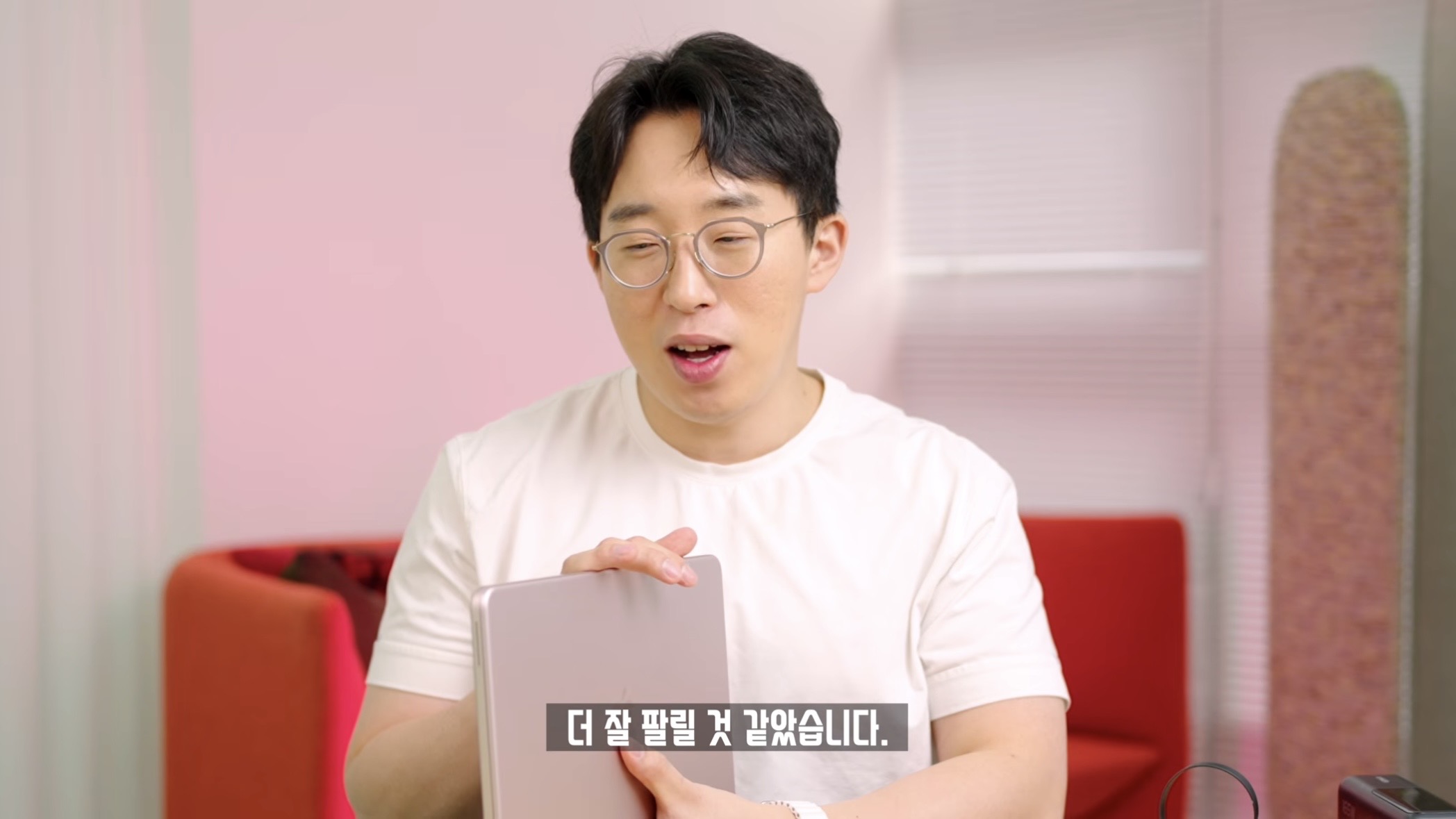 Comparison shot showing the thin profile of the MacBook Neo versus the MacBook Air