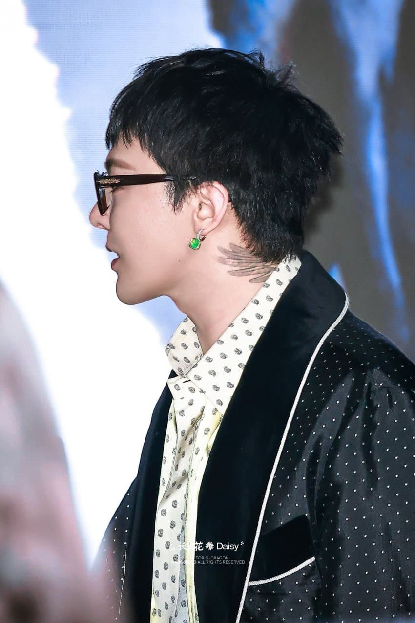 Close-up of G-Dragon looking sharp in a Tom Ford suit