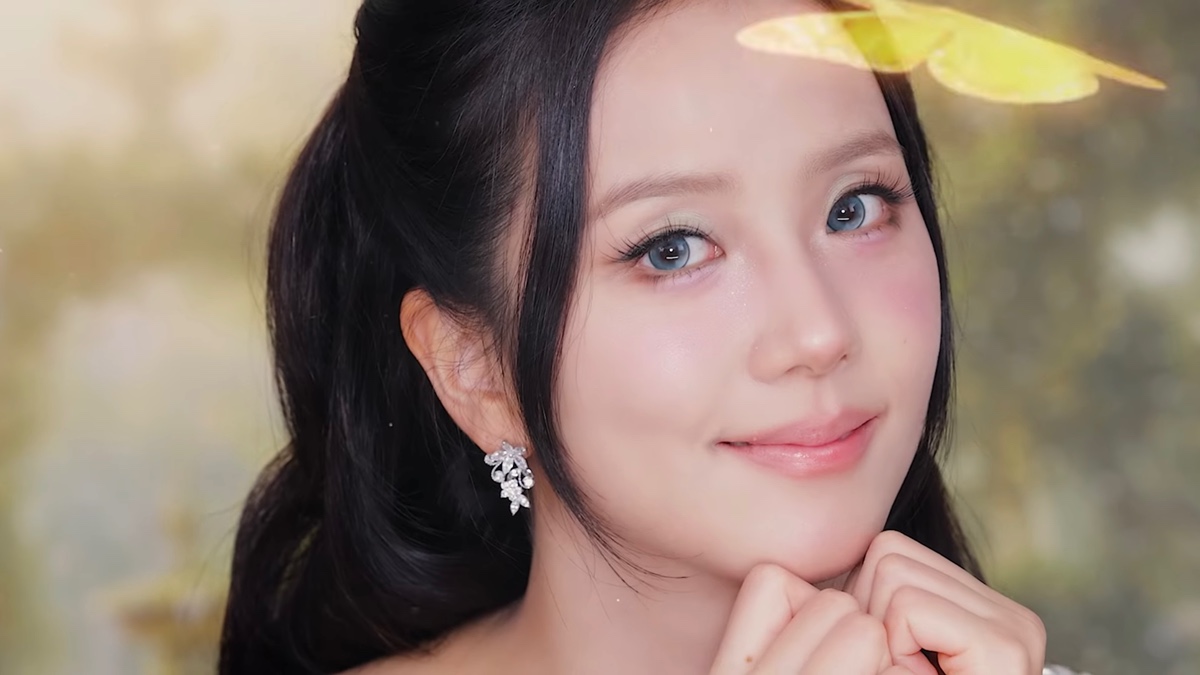 BLACKPINK's Jisoo posing with a serene expression, showcasing her elegant makeup, with soft lighting enhancing her features.