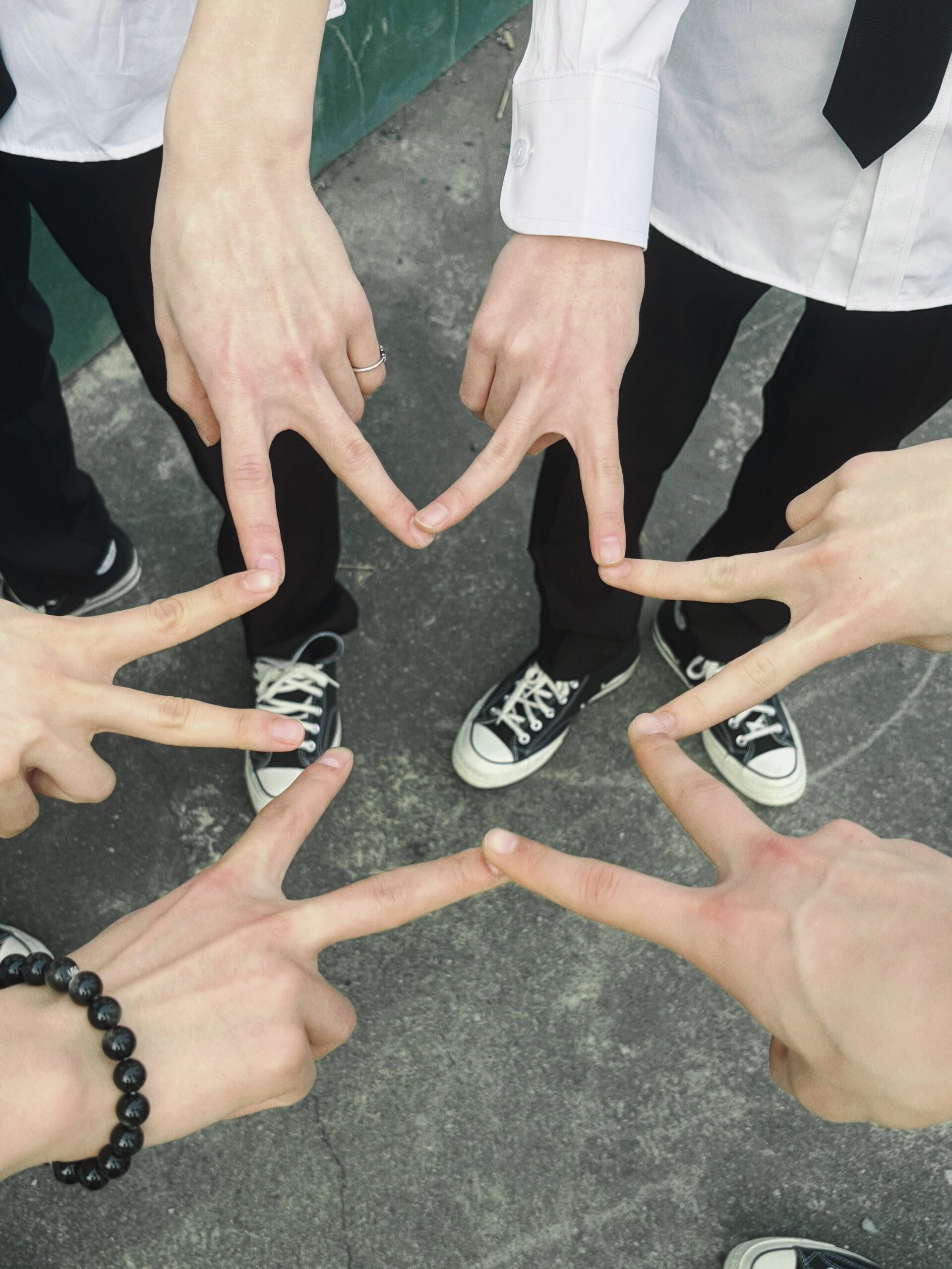 Close up of NCT WISH member in school uniform showing the detailed embroidery