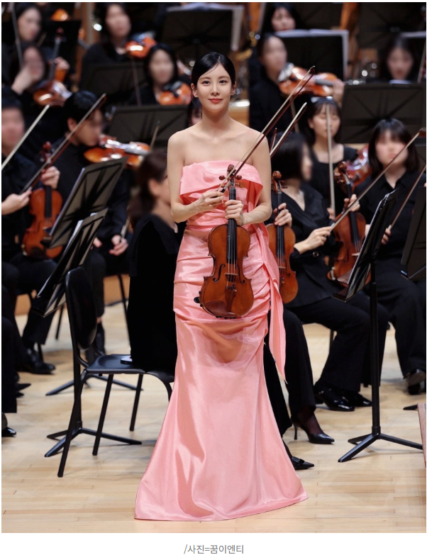 Close up of Seohyun's focused expression during her violin solo performance