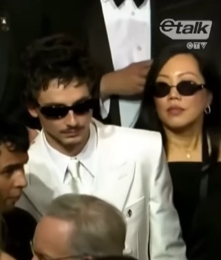 Timothée Chalamet attending the recent Oscars with his professional PR team in the background.