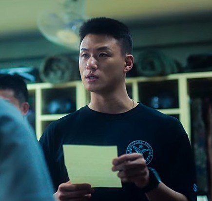 Shin Seung-ho looking sharp in a modern portrait, showcasing his intense yet versatile gaze.