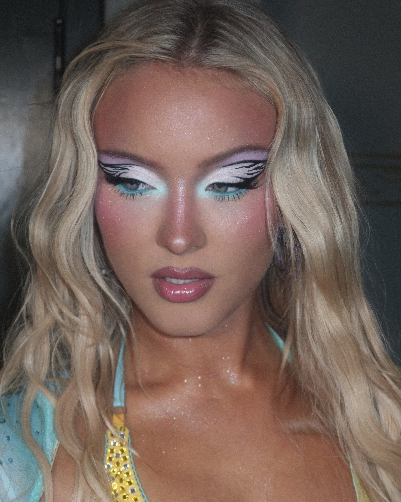 Close-up of Zara Larsson's viral makeup look, showing soft eye makeup and glowing skin.