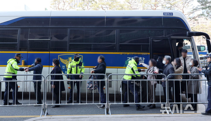 Police security checks near Seoul Plaza during BTS comeback event