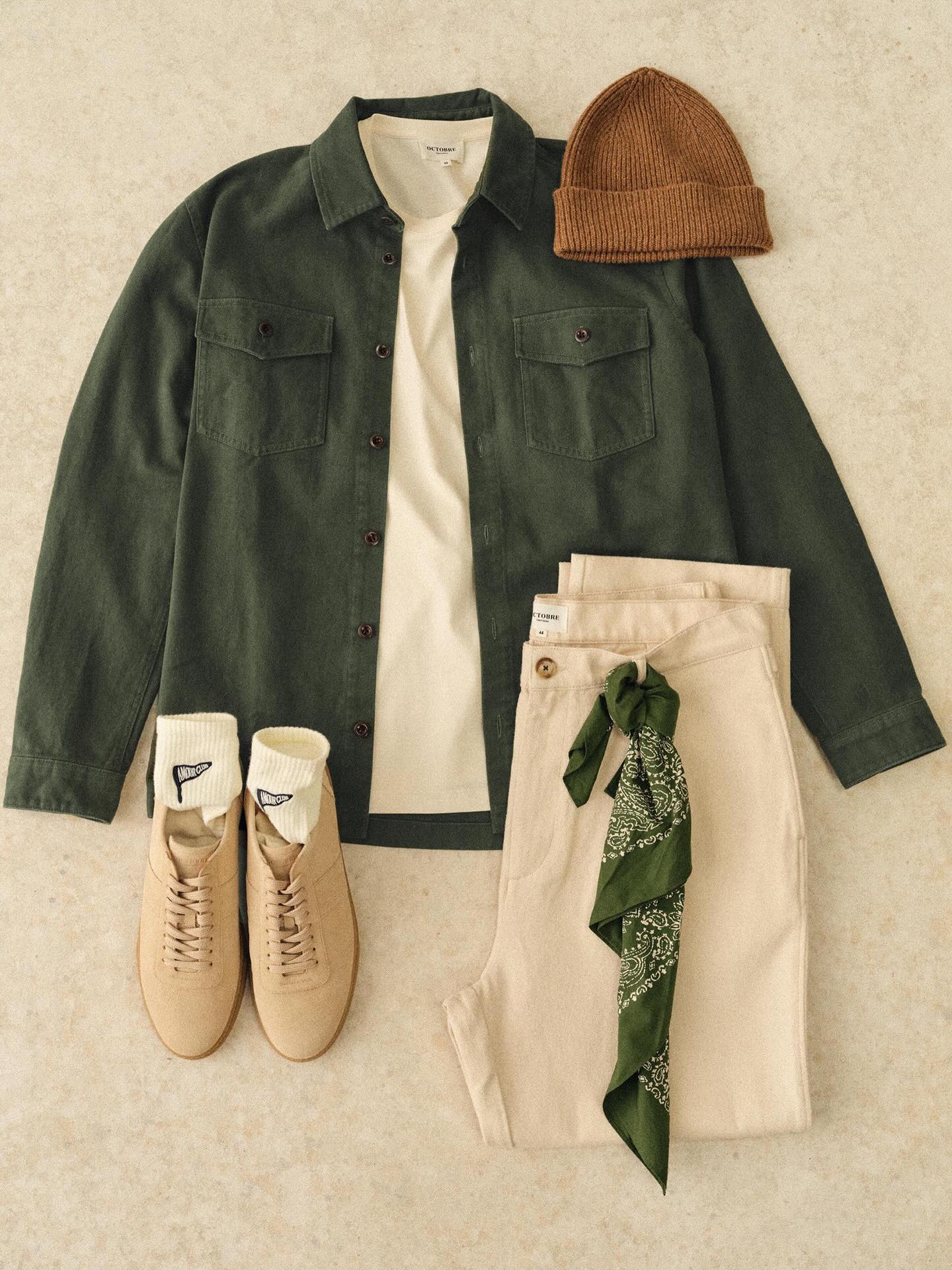 Close-up of Octobre Éditions layering with a denim jacket and a cozy scarf, perfect for the spring transition.