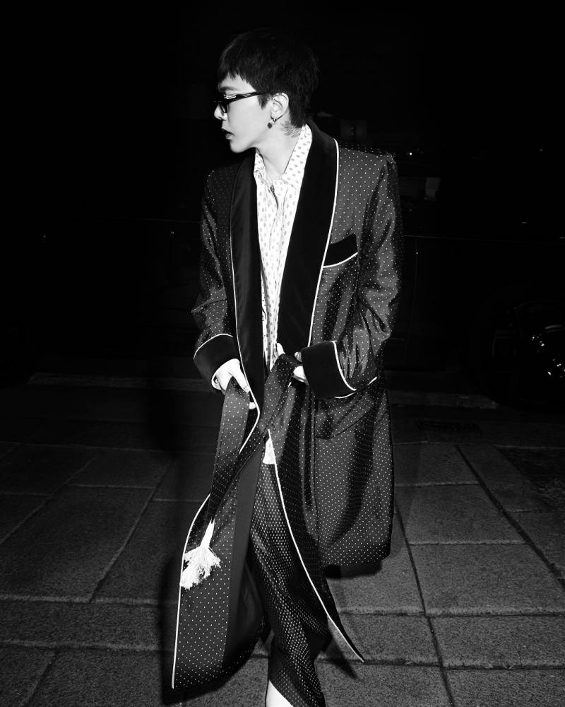G-Dragon looking iconic in a high-fashion editorial shot showing his unique styling.