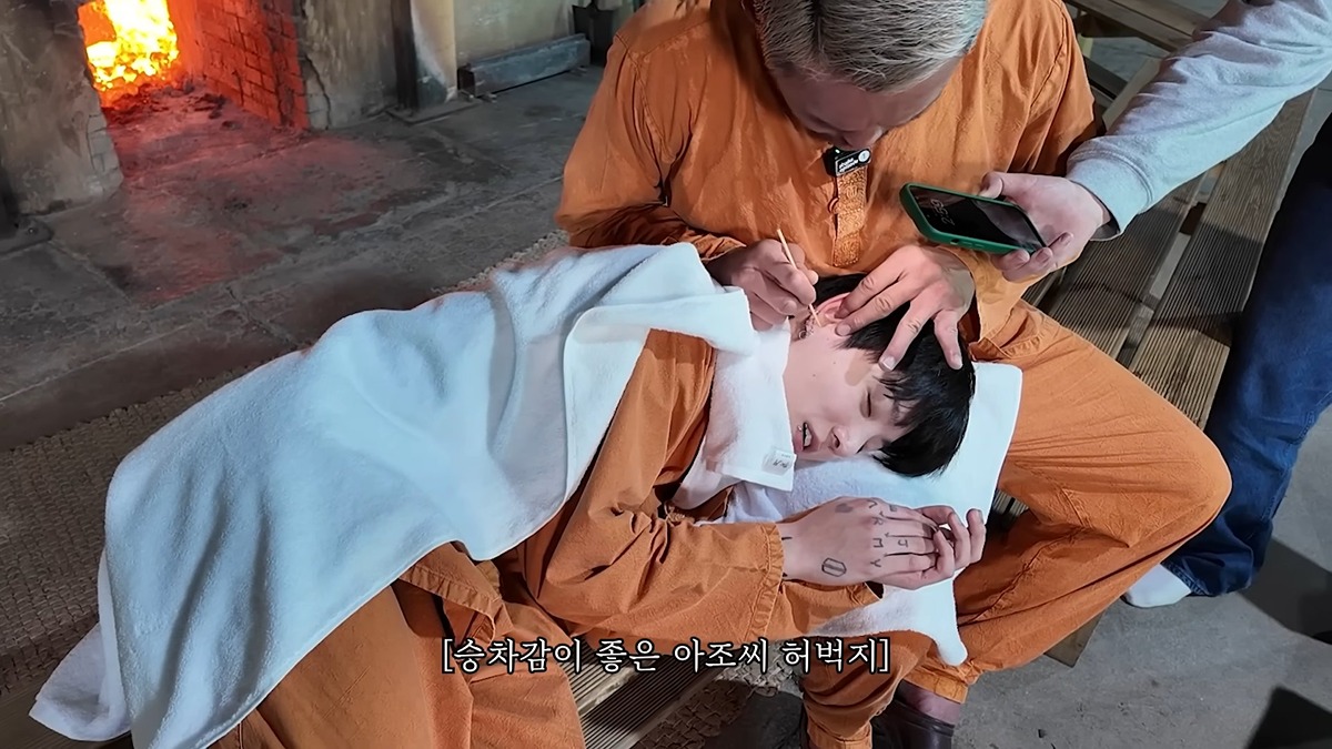 Choo Sung-hoon and BTS Jungkook sharing a close, friendly moment together during a broadcast