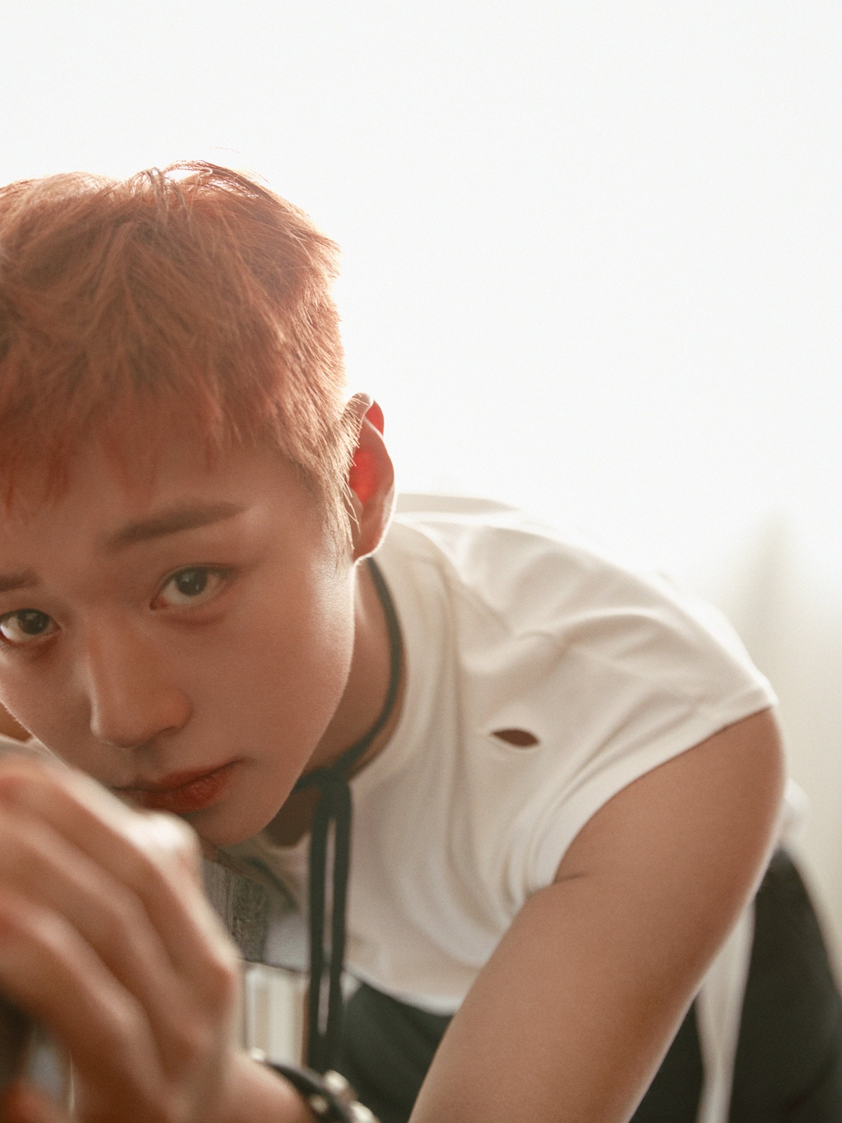 Park Ji-hoon in a wide shot for RE:FLECT, showcasing the set design and the reflective theme.