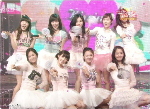 A nostalgic, soft-toned photo of K-pop idols embodying the innocent concept that fans are currently craving on Korean forums