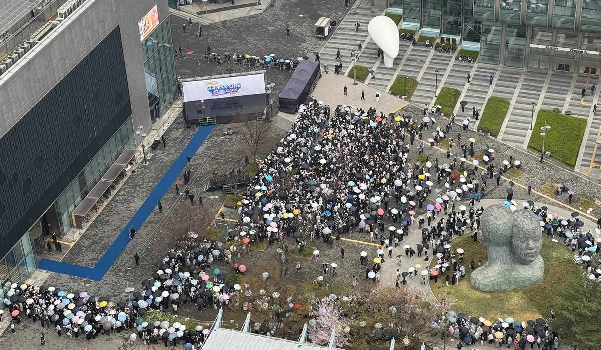 Close up of the members reacting to the crowd during their 2026 reunion