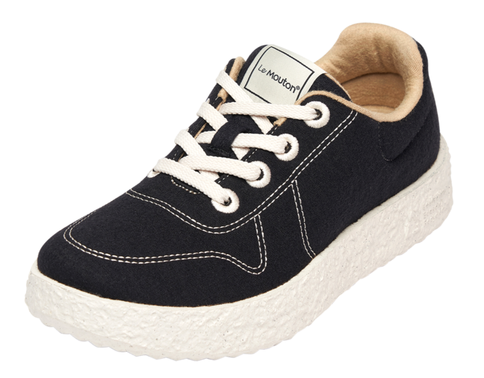 A close-up of the Le Mouton Mate shoe highlighting its soft wool texture and minimalist design.