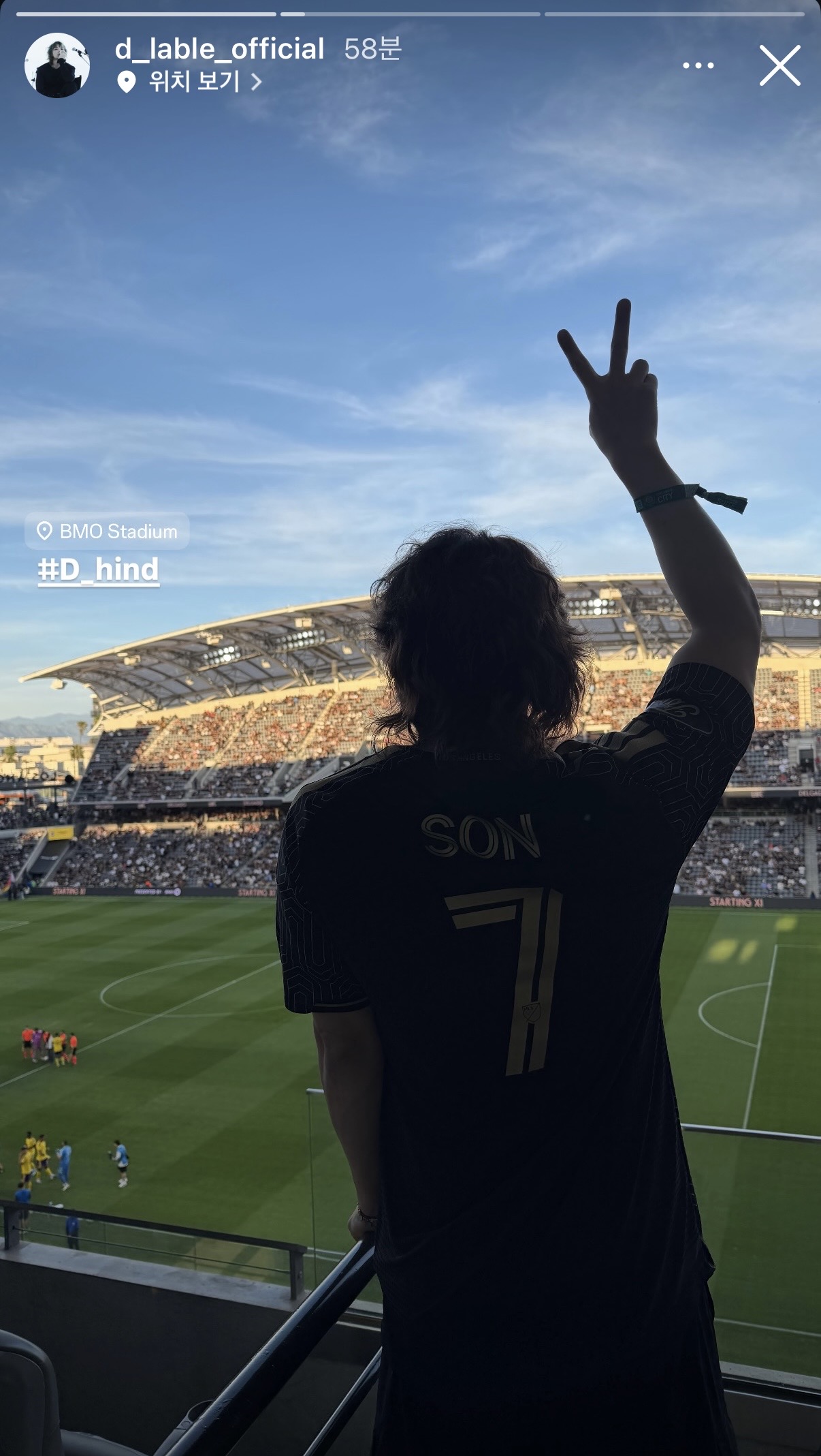 A candid shot of BIGBANG members enjoying the match in Los Angeles during Coachella week